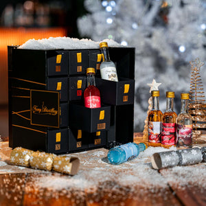 12 Day Gin Advent Calendar Christmas 2023 - Newy Distillery. Gin Advent calendar in snow scene, Christmas crackers. Boozy Advent Calendar.