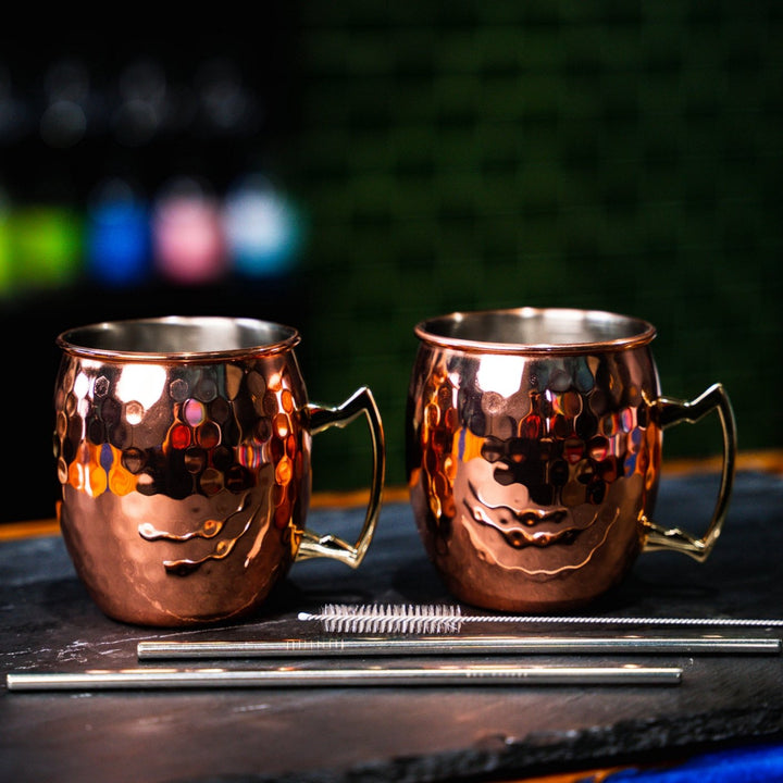 Hammered Copper Moscow Mule Mugs with metal straws and straw cleaning brush. Newy Distillery.