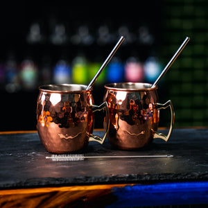 Hammered Copper Moscow Mule Mugs with metal straws and straw cleaning brush. Newy Distillery.