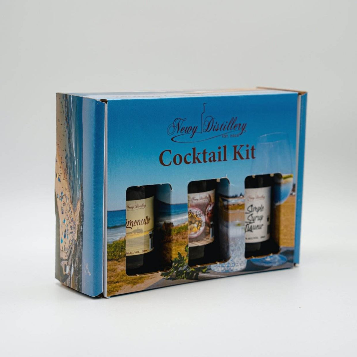 Passionfruit Gin Caipiroska Cocktail Kit by Newy Distillery. Gift box, front view at angle.